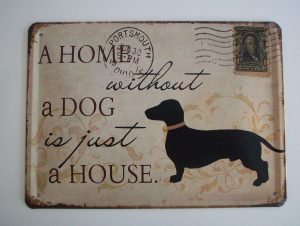 Metallskylt "A home without a dog..."